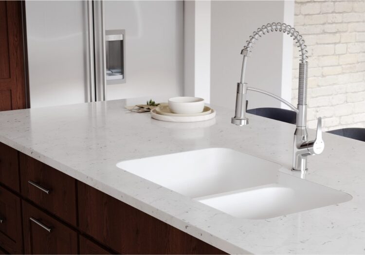 karran seamless undermount sink with dark wood cabinets