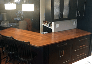 black kitchen with solid wood butcher block countertops